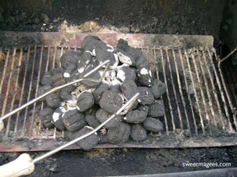 arrange charcoal on lit grill